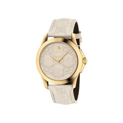 Gucci G-Timeless Signature / orologio donna / quadrante crema / cassa acciaio e PVD dorato / cinturino pelle