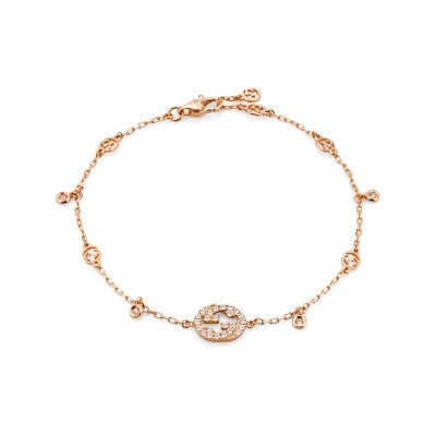 Gucci / Interlocking G / bracciale con incrocio GG e ciondoli / oro rosa e diamanti