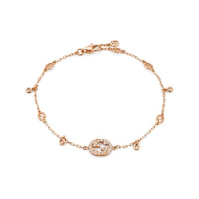 Gucci / Interlocking / bracciale con incrocio GG e ciondoli / oro rosa e diamanti