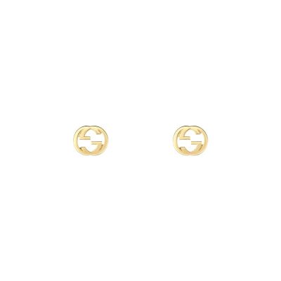Gucci / Interlocking G / orecchini a bottone con incrocio GG / oro giallo