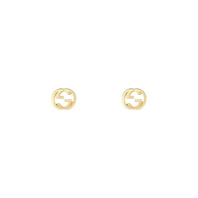 Gucci / Interlocking G / orecchini a bottone con incrocio GG / oro giallo